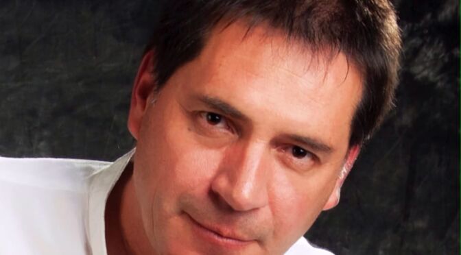 luis head shot photo for his book